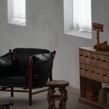 "Lounge chair 'Ilona' by Arne Norell in stained beech and leather, mid-20th century."