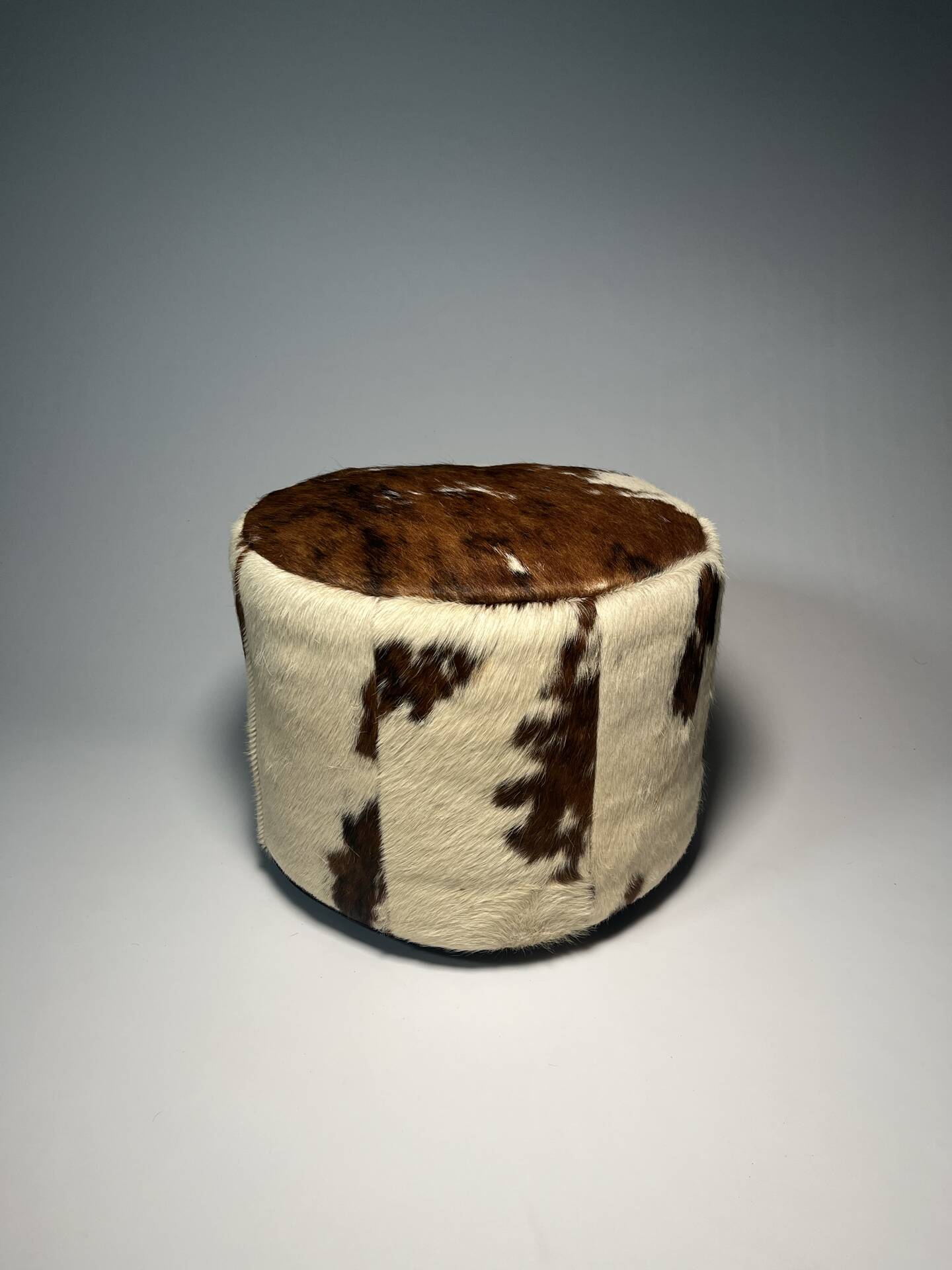 Vintage cowhide pouf from the 80s.