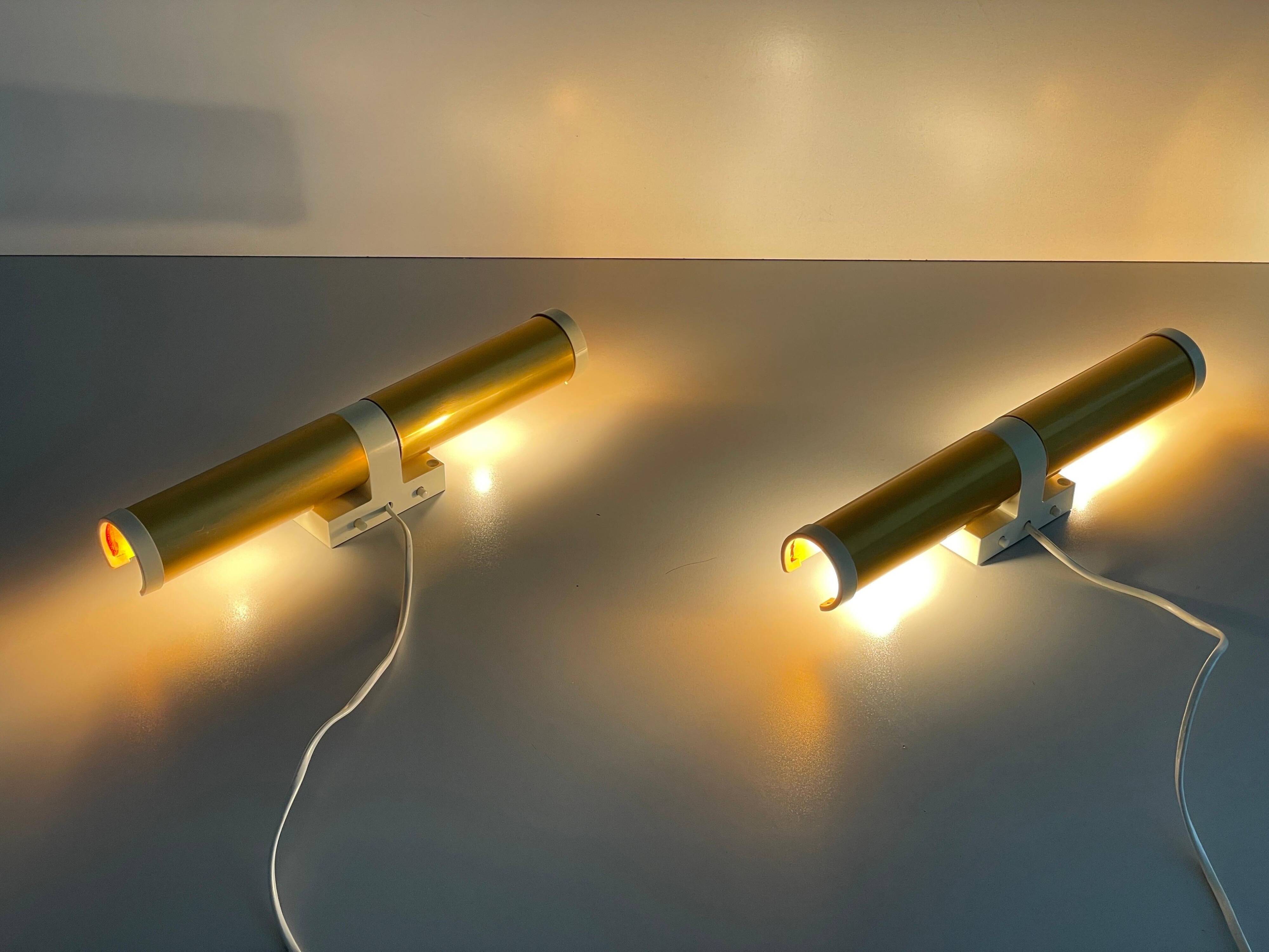 Pair of two-headed wall sconces in gold metal by ERCO, 1970s, Germany
