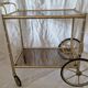 Rolling dessert trolley in gilded brass & glass from the 1970s in the style of Maison Jansen.