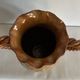 Large antique ceramic vase with two twisted handles.