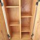 Small wooden piece of furniture, cabinet style, false drawers.