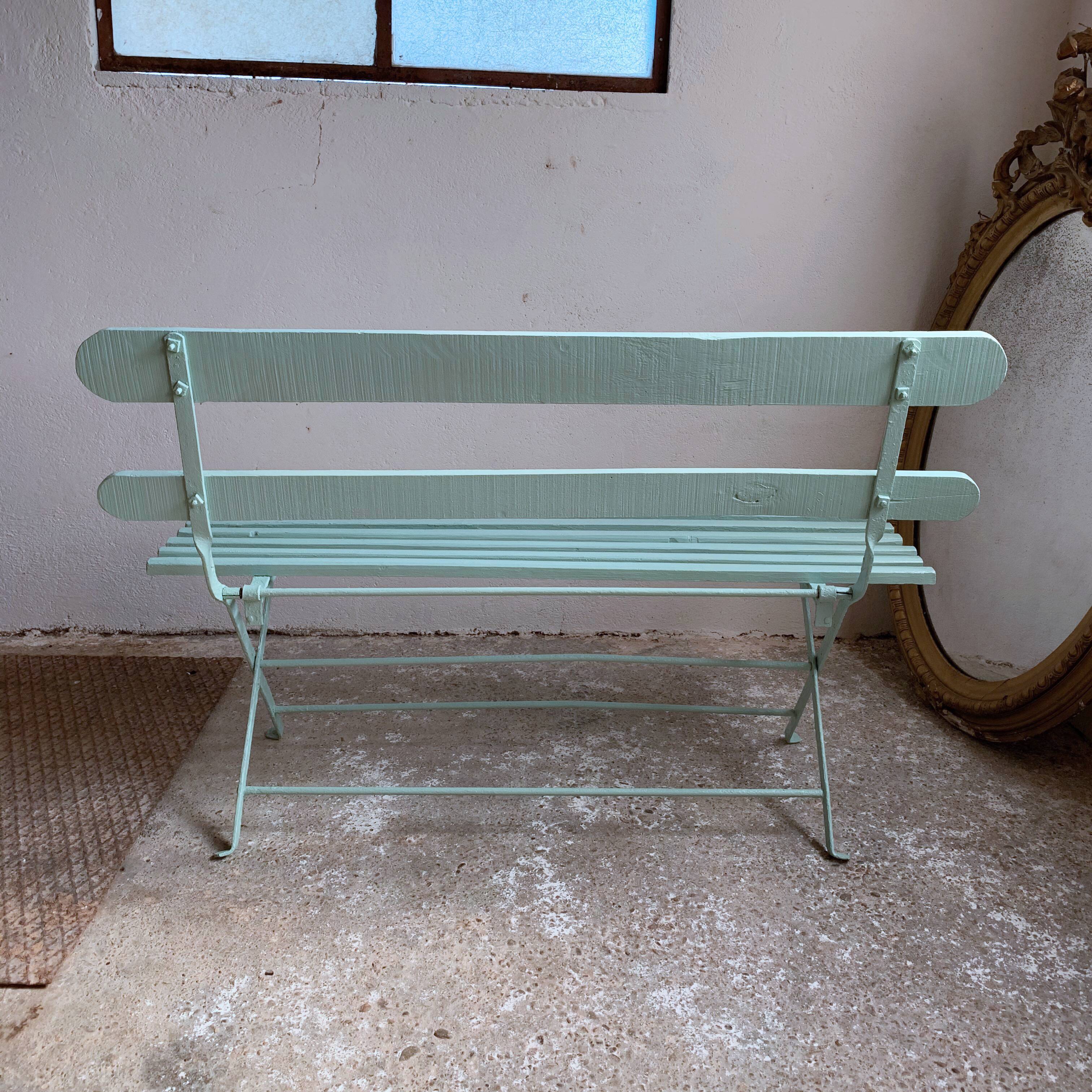 Former folding garden bench with wooden and metal slats