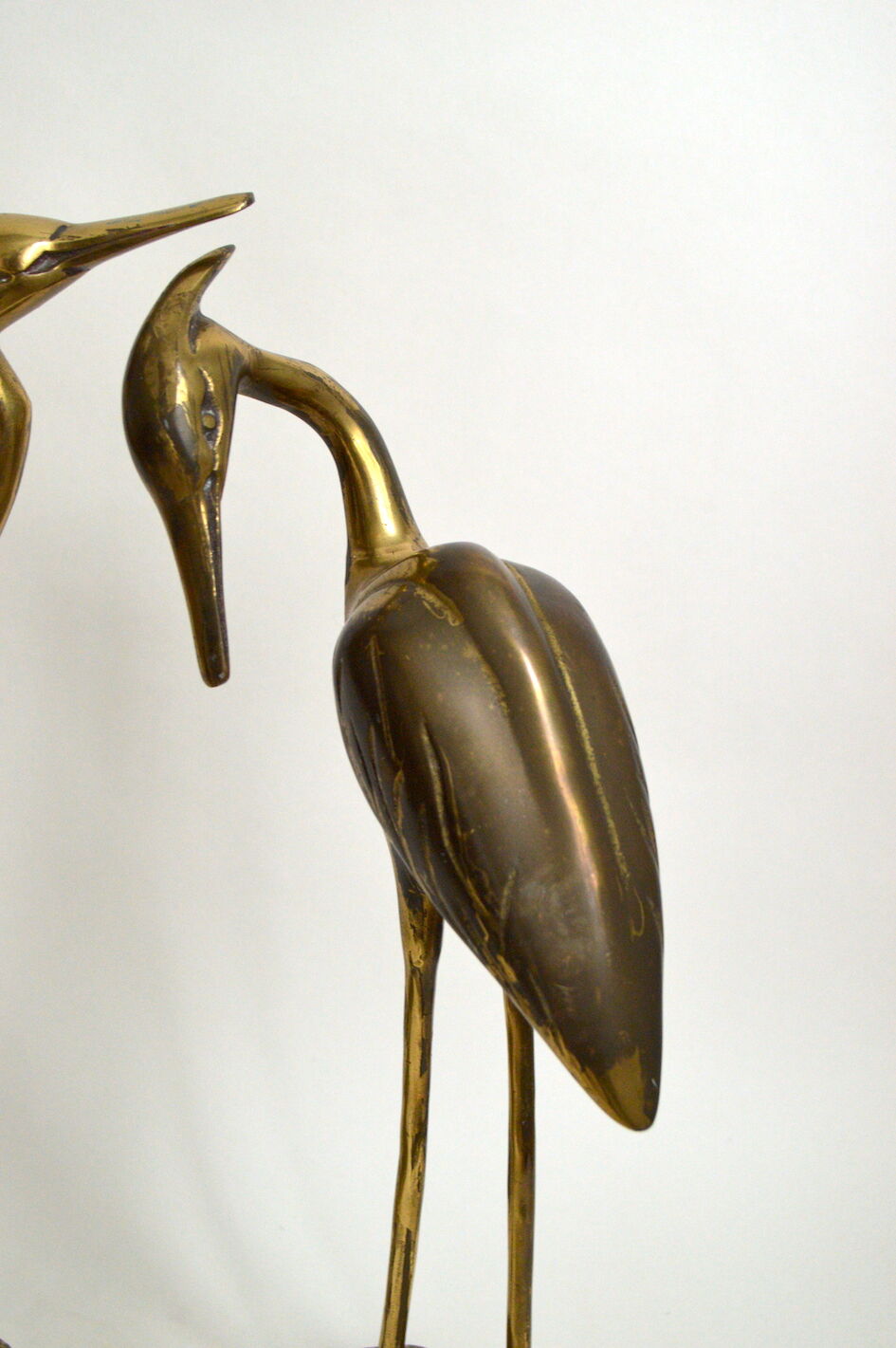 Brass herons couple