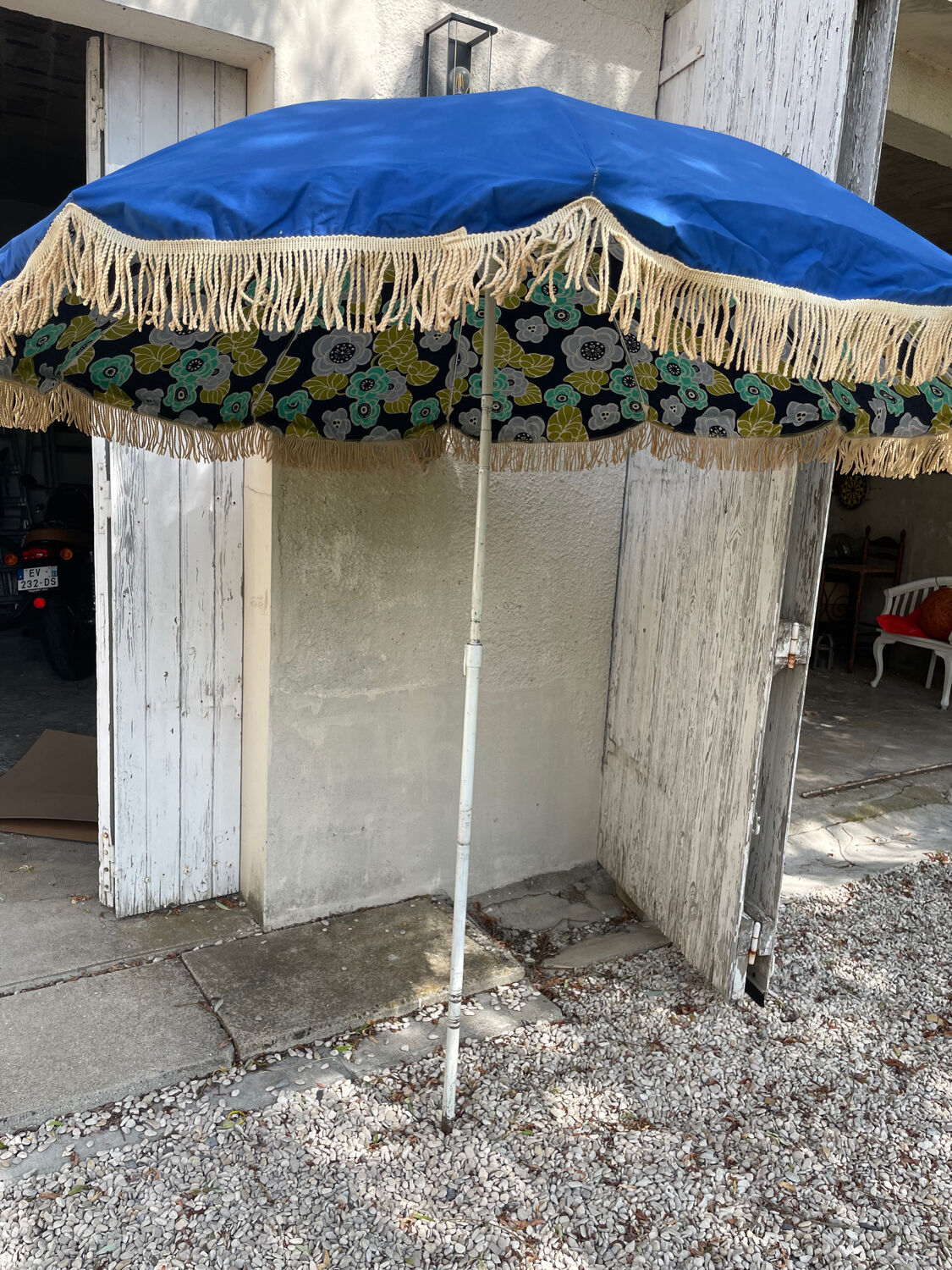 Blue parasol and flowers