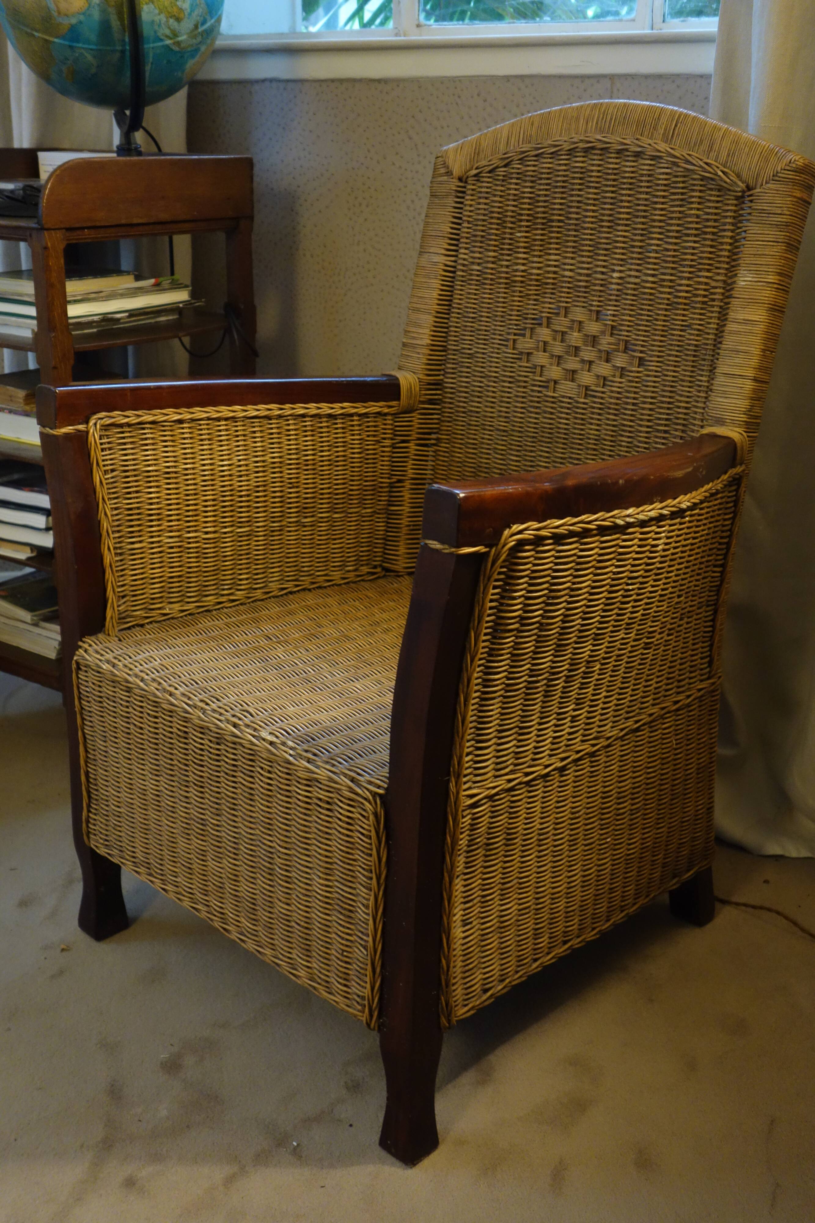 comfortable colonial-style armchair in rattan and mahogany