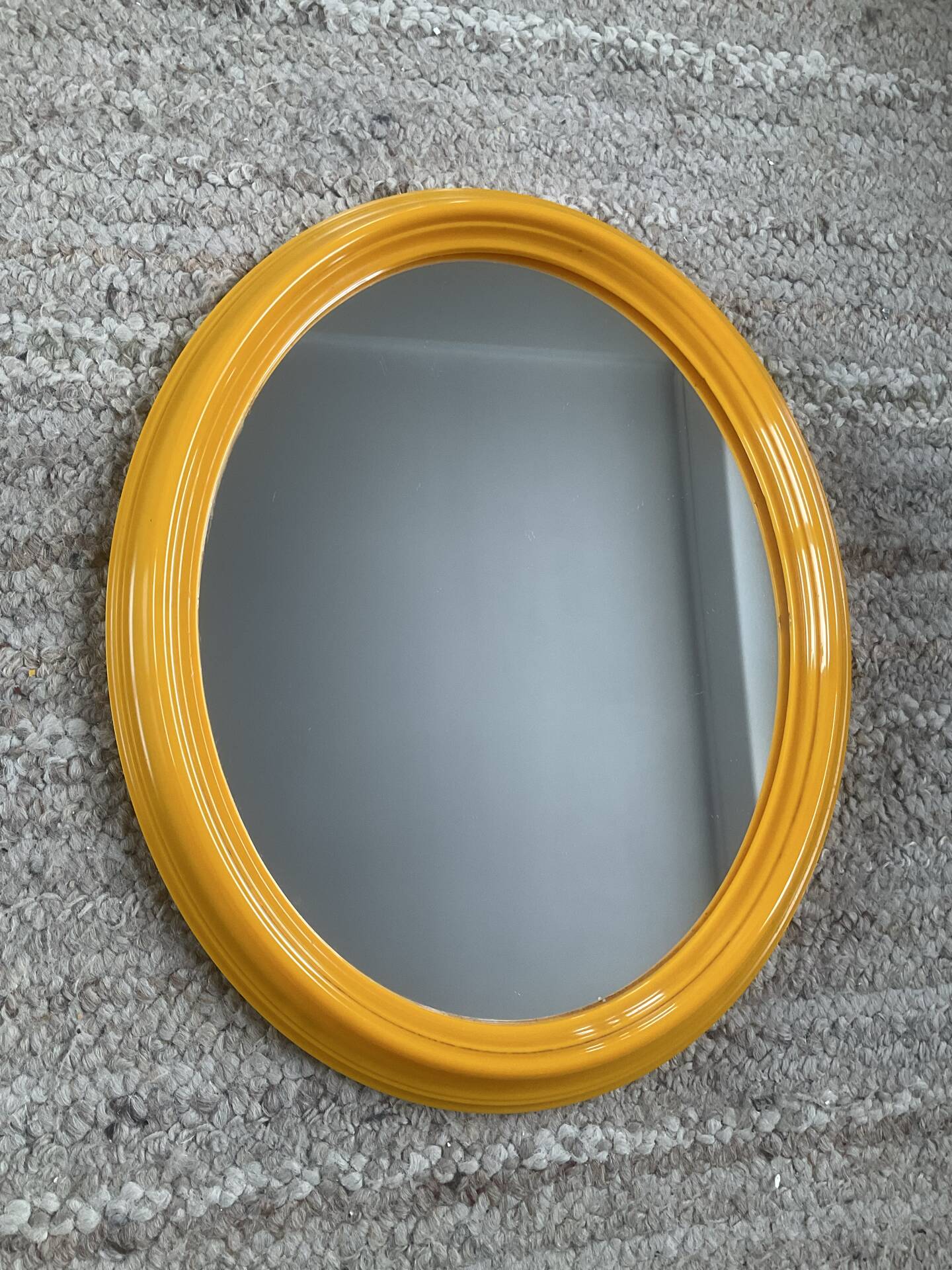 Vintage oval mirror from the 1970s.