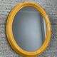 Vintage oval mirror from the 1970s.