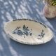 Iron flat plate with a 19th-century bird signed Onnaing "Poppies"