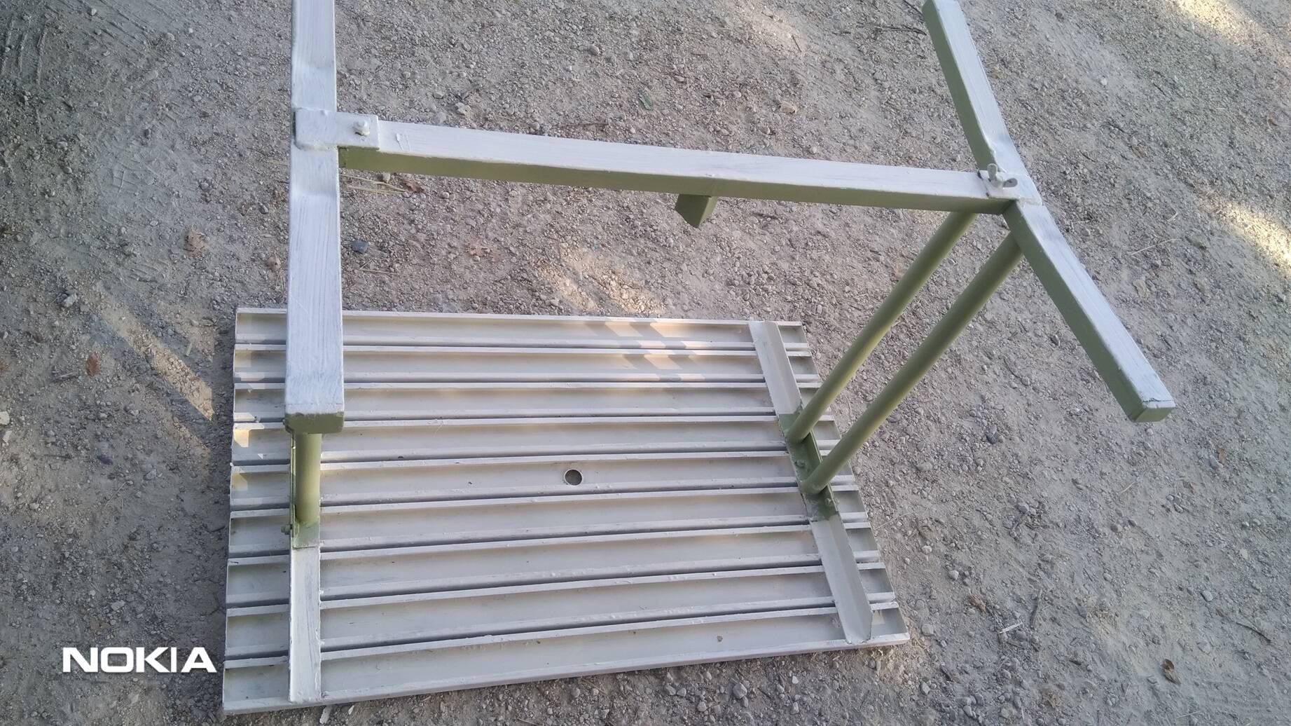 Old garden table with iron slats