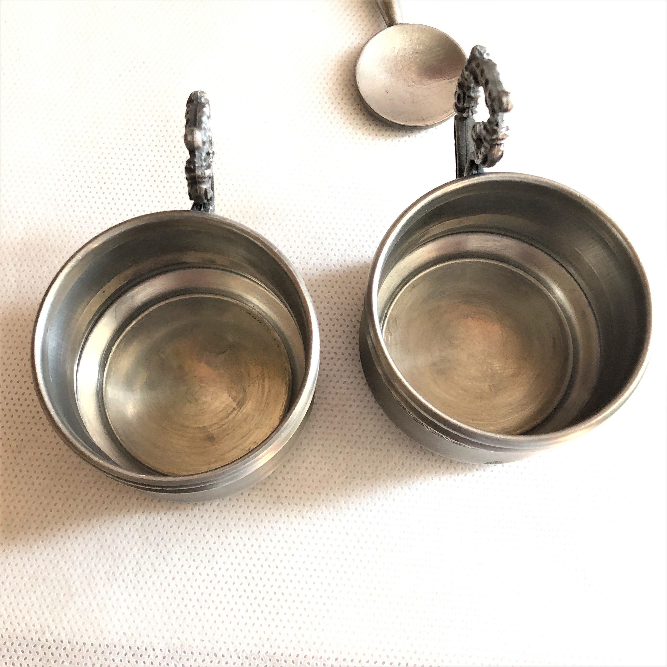 Set two porcelain cups with pewter support