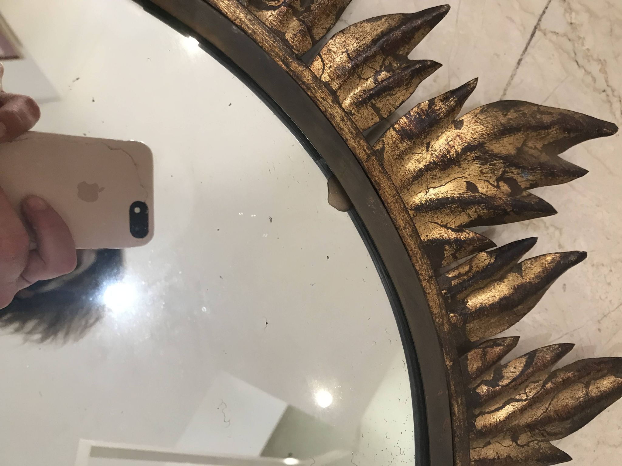 Sun mirror decorated with golden leaves, circa 1950.