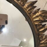 Sun mirror decorated with golden leaves, circa 1950.