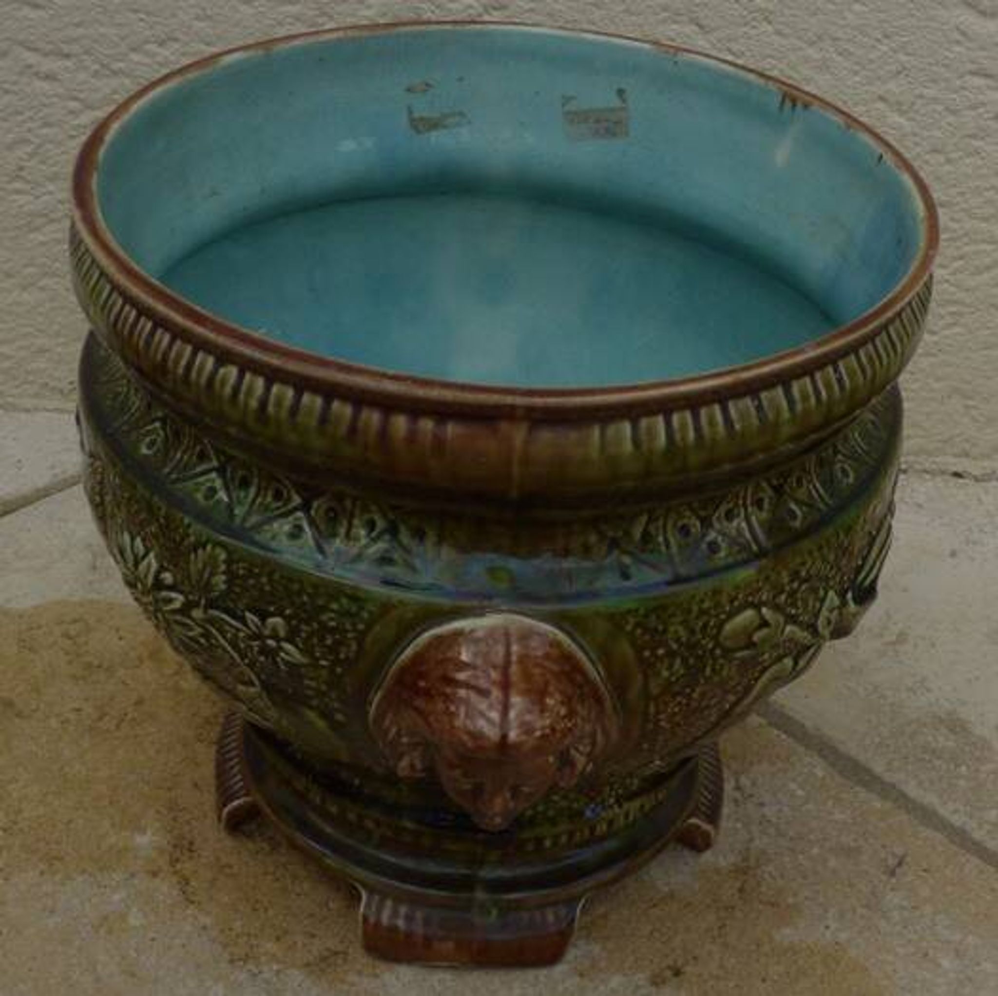Old earthenware cachepot with woman decoration