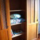 Armoire bois blond et rotin