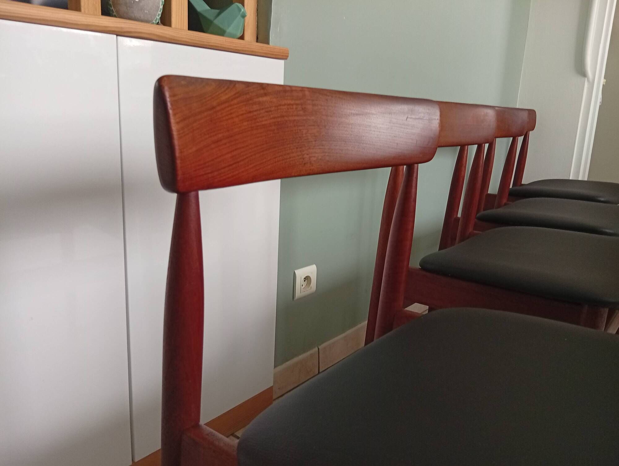 Four Danish mid-century teak armchairs.