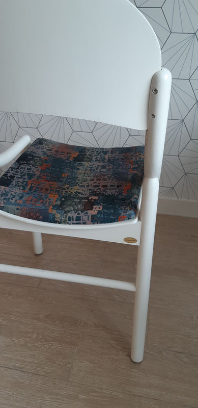 White Baumann chair.