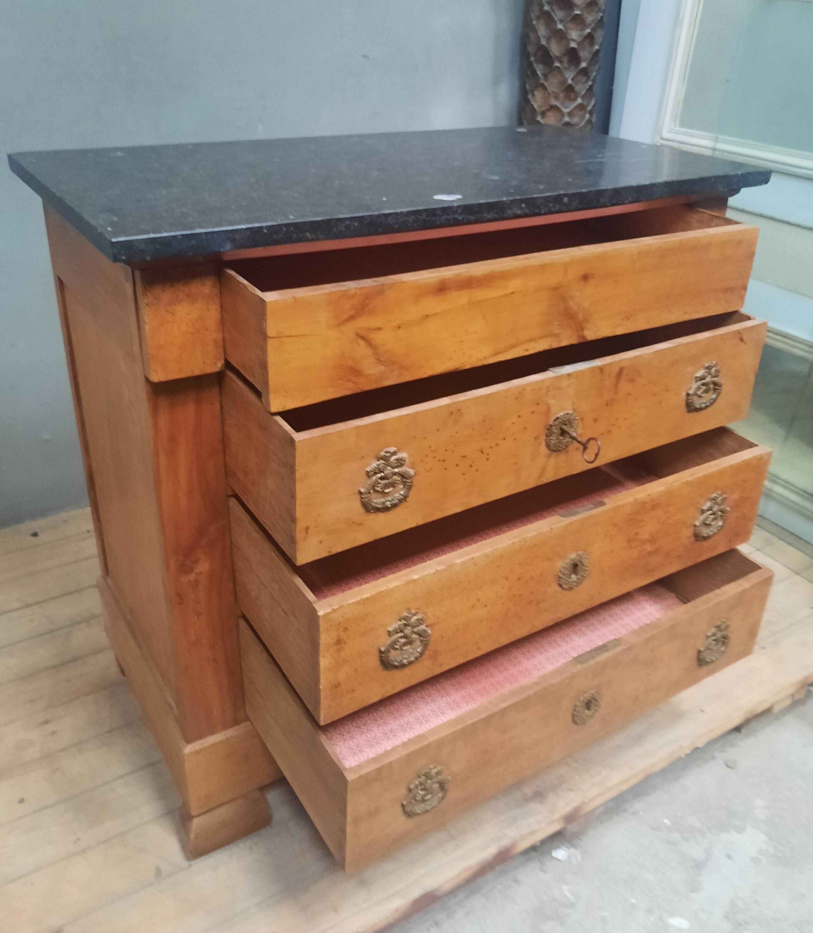 Nineteenth-century commode with marble top.
