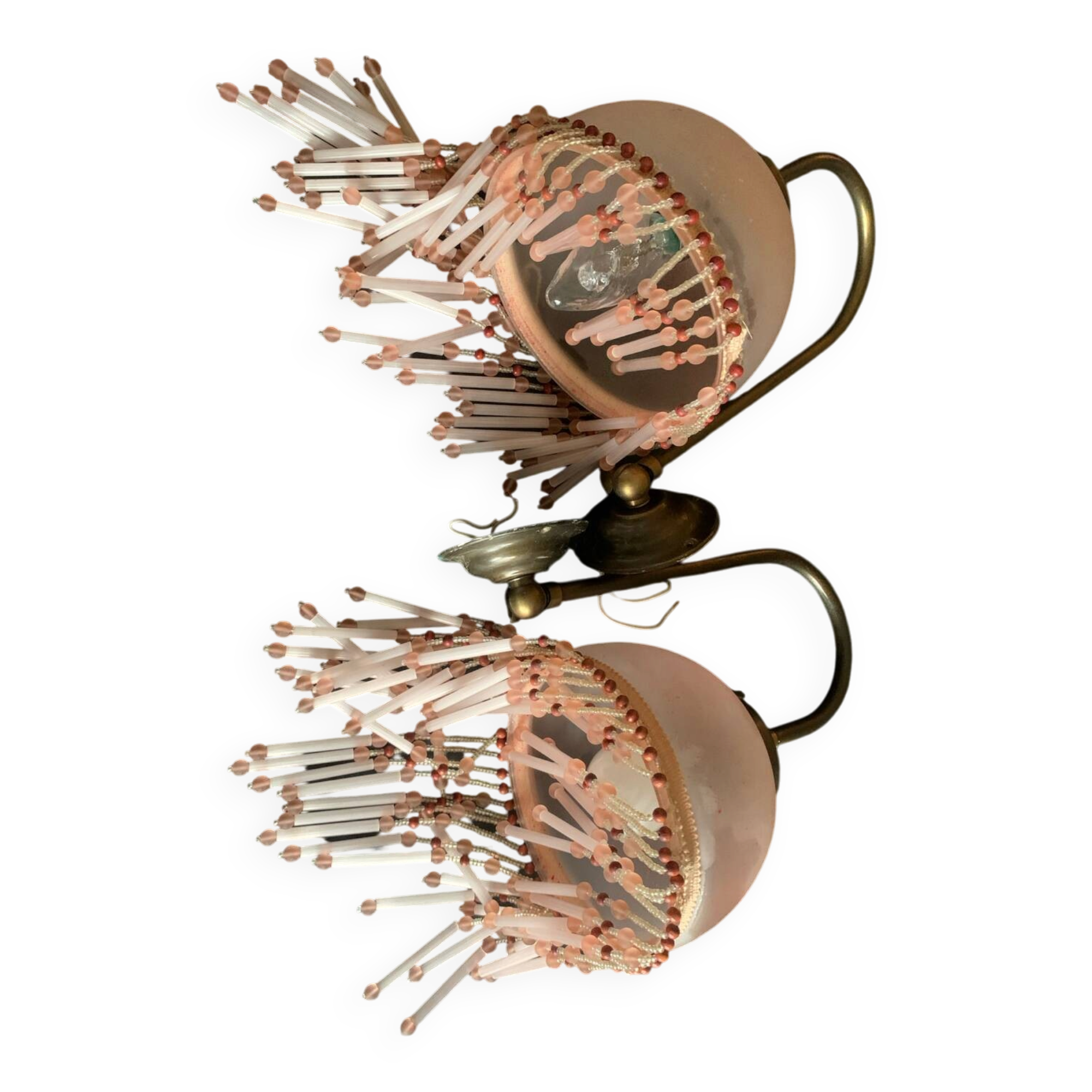Pair of wall sconces in pink glass and pendants.
