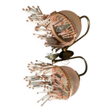 Pair of wall sconces in pink glass and pendants.