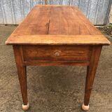 Antique solid cherry farmhouse table with 2 end drawers and 1 pull-out.