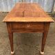 Antique solid cherry farmhouse table with 2 end drawers and 1 pull-out.