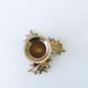 Candlestick in brass holly design