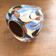 Vase dripping in varnished earth