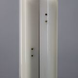 Mid-century modern floor lamp on iron legs with plastic shade and wood accent