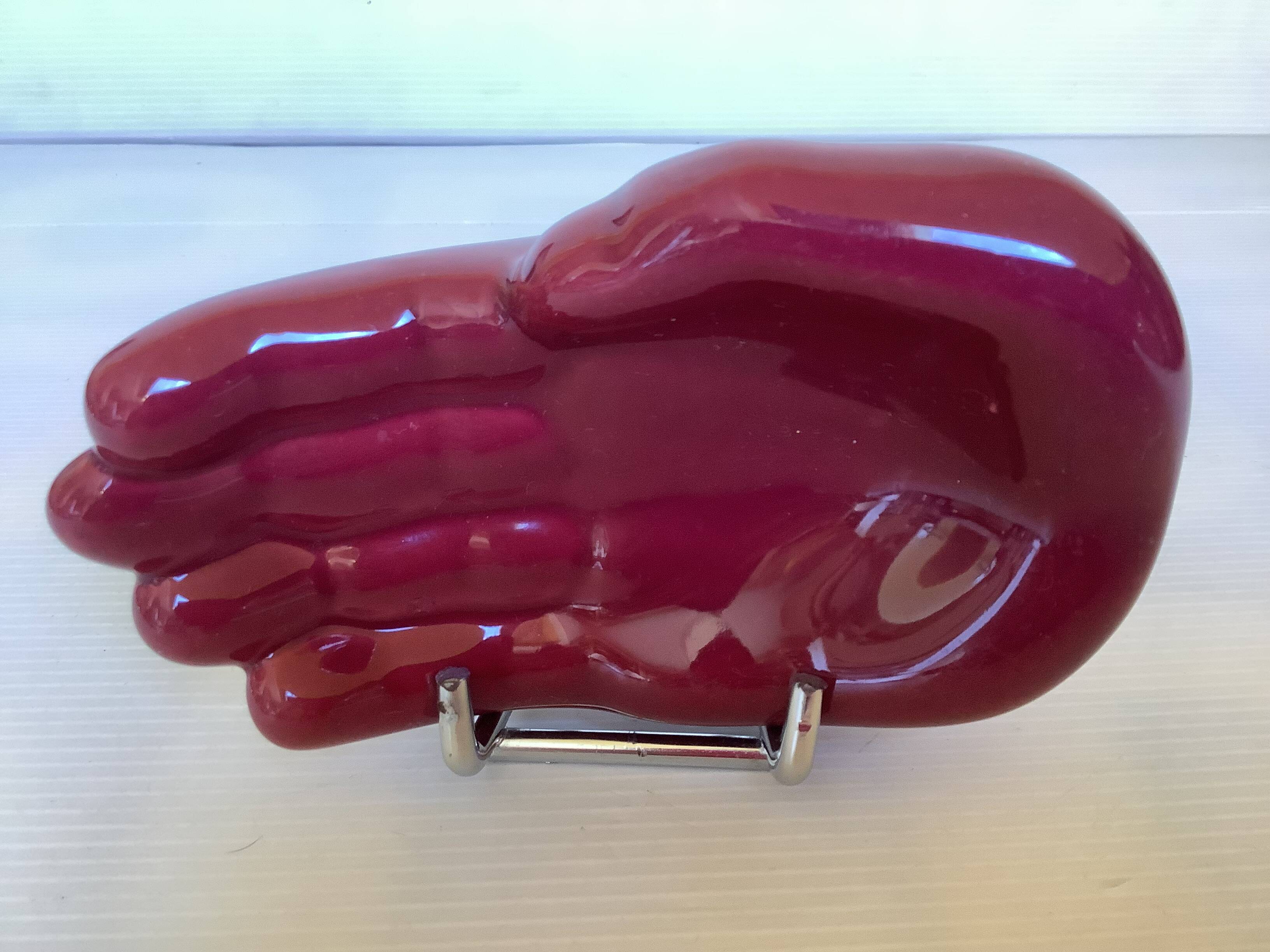 Burgundy hand emptier