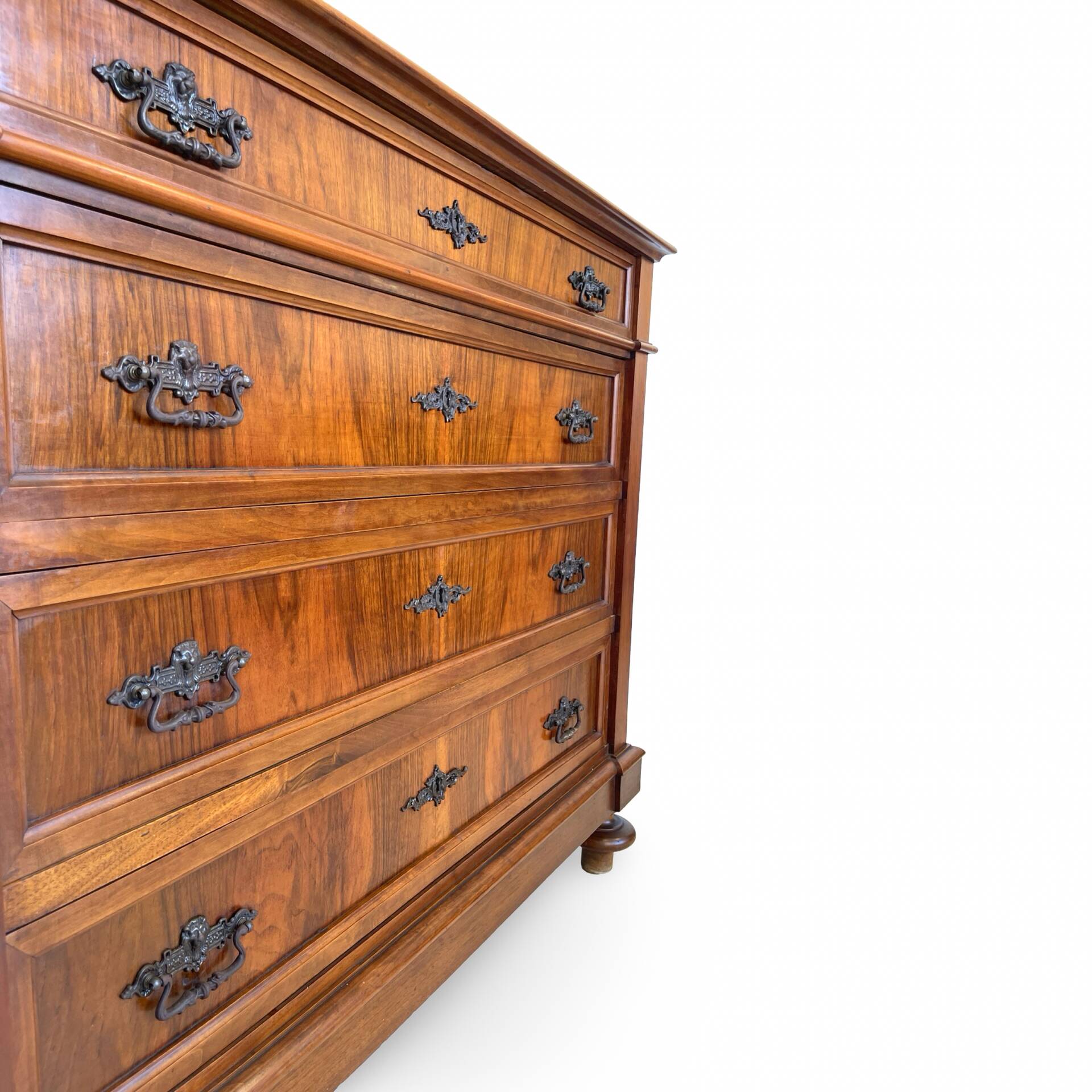 Antique walnut commode with bronze handles in the shape of a lion's mask,