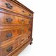 Antique walnut commode with bronze handles in the shape of a lion's mask,