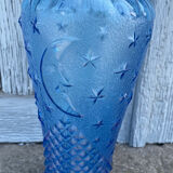 Blue glass decanter with a moon star motif