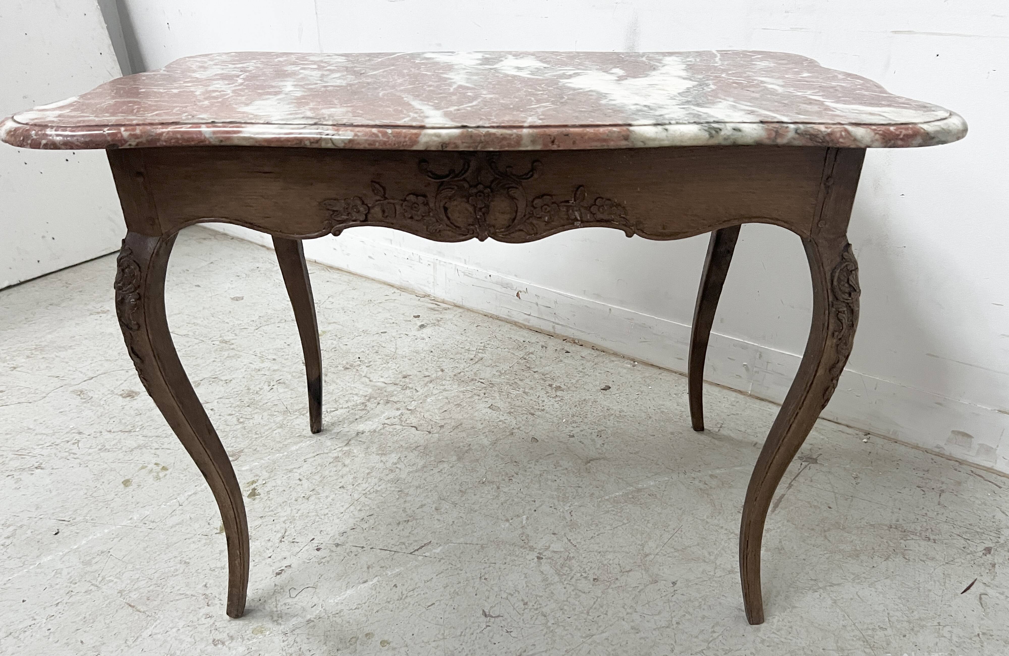 Louis XV mid-table in oak and marble, 18th century.