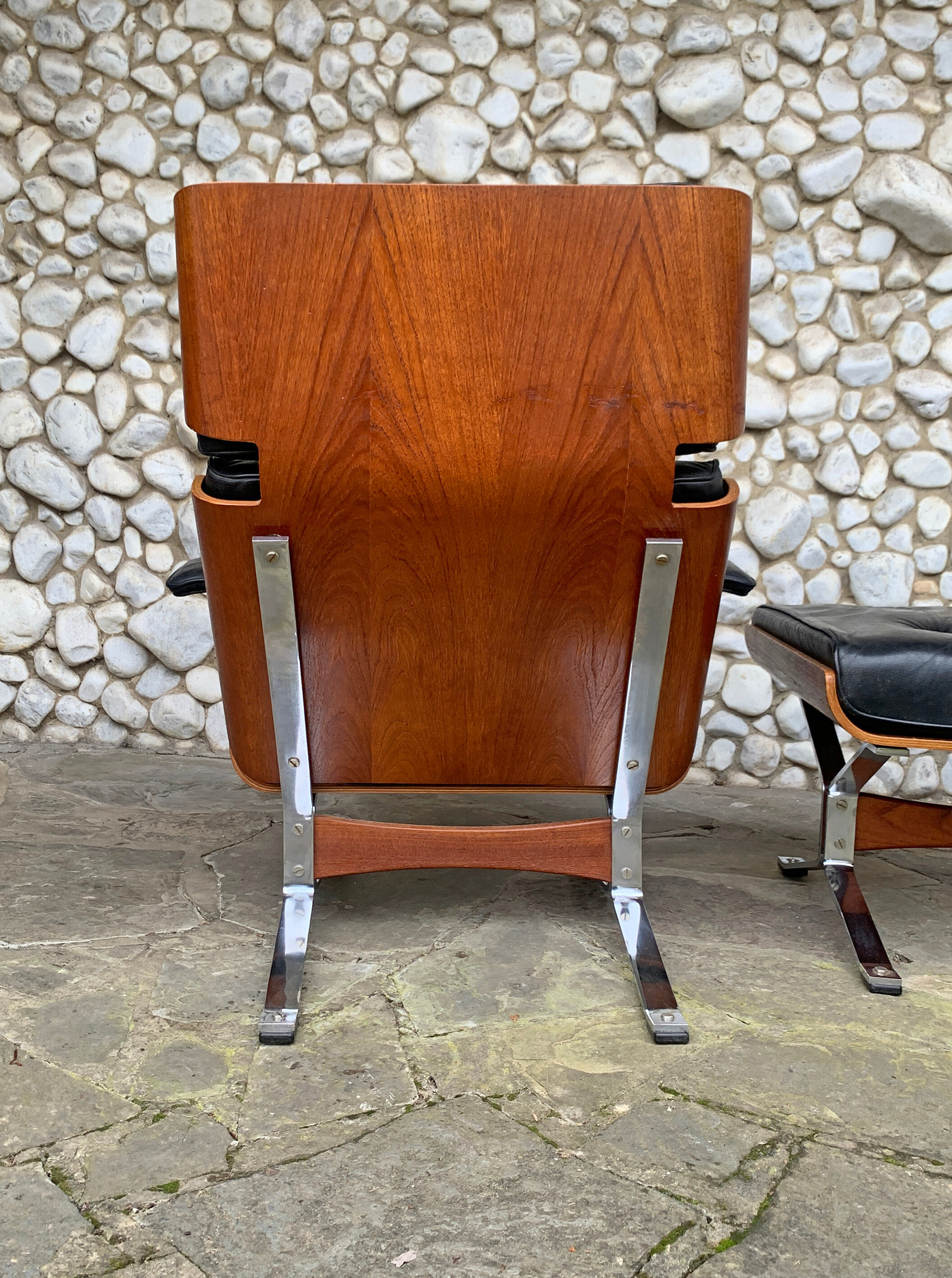 Lounge chair and ottoman black leather and teak multiplex, 1960