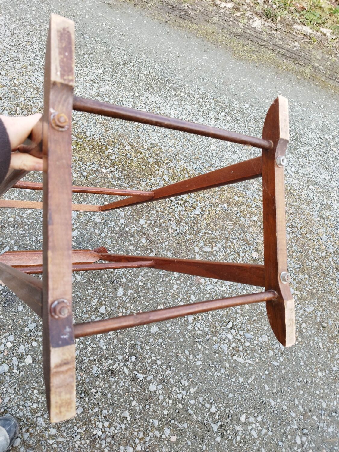 Valet wearing double wood coat rack