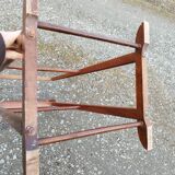 Valet wearing double wood coat rack