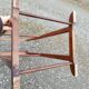 Valet wearing double wood coat rack