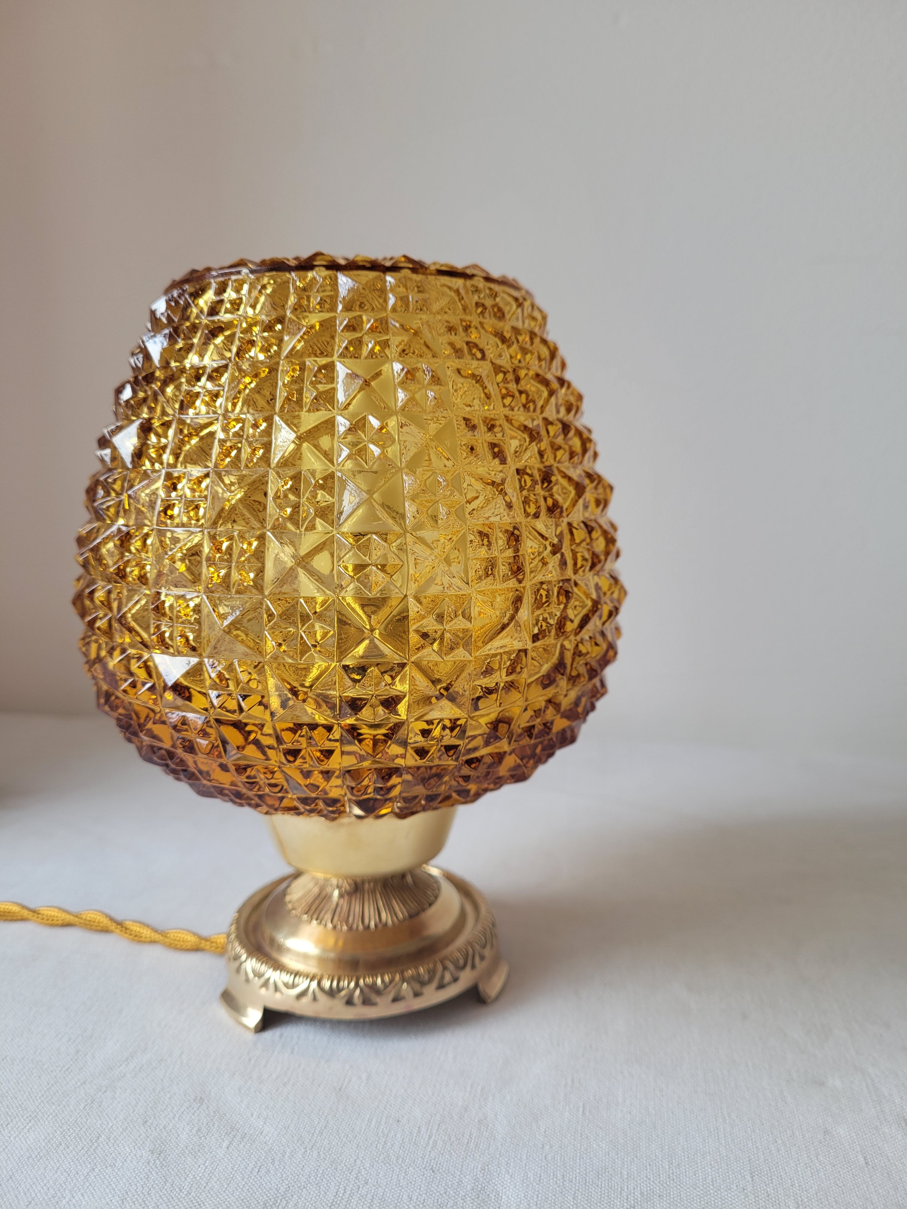 Bedside lamp in amber glass and brass