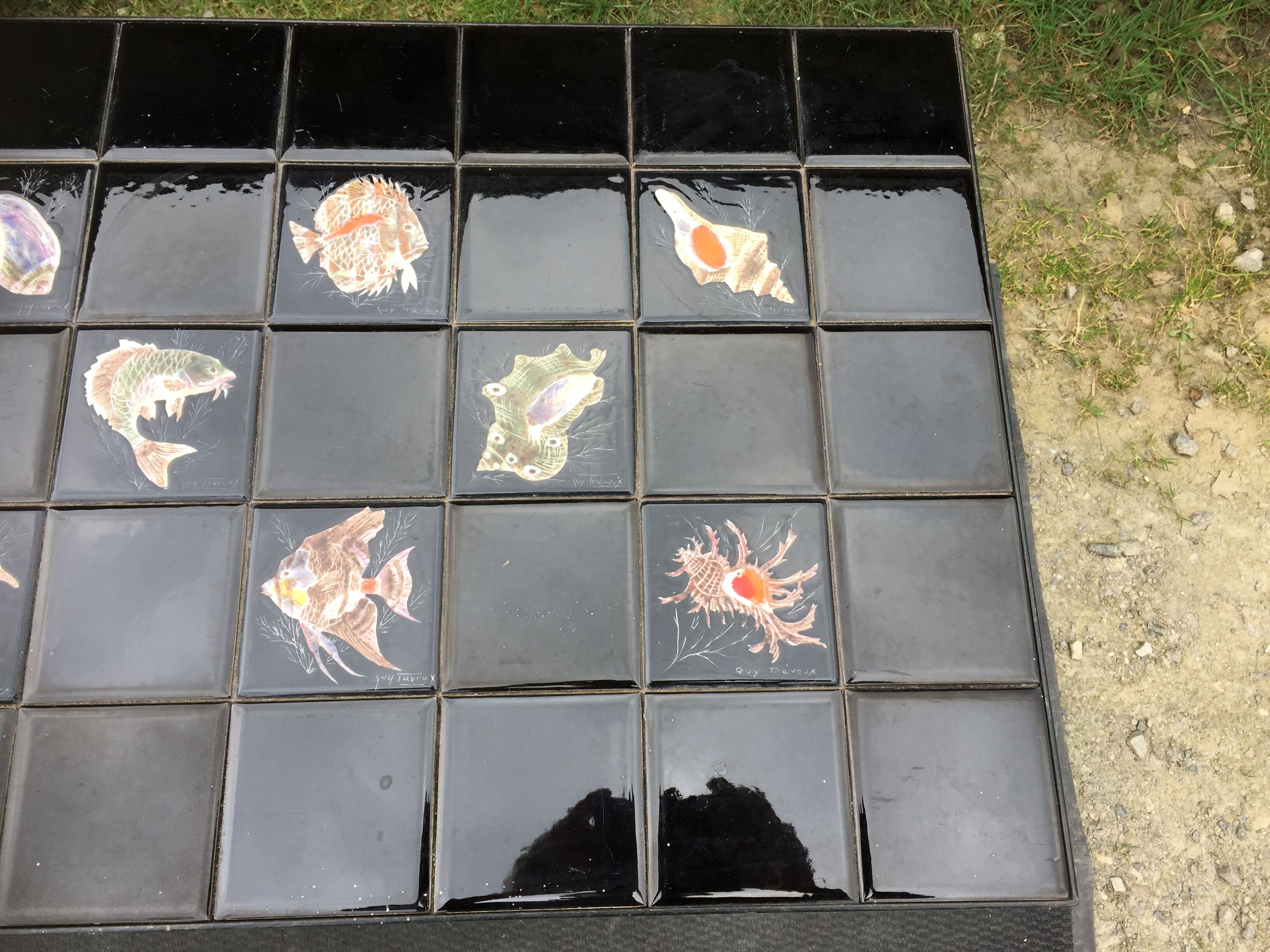 Vintage ceramic coffee table by Guy Trévoux with wrought iron base.