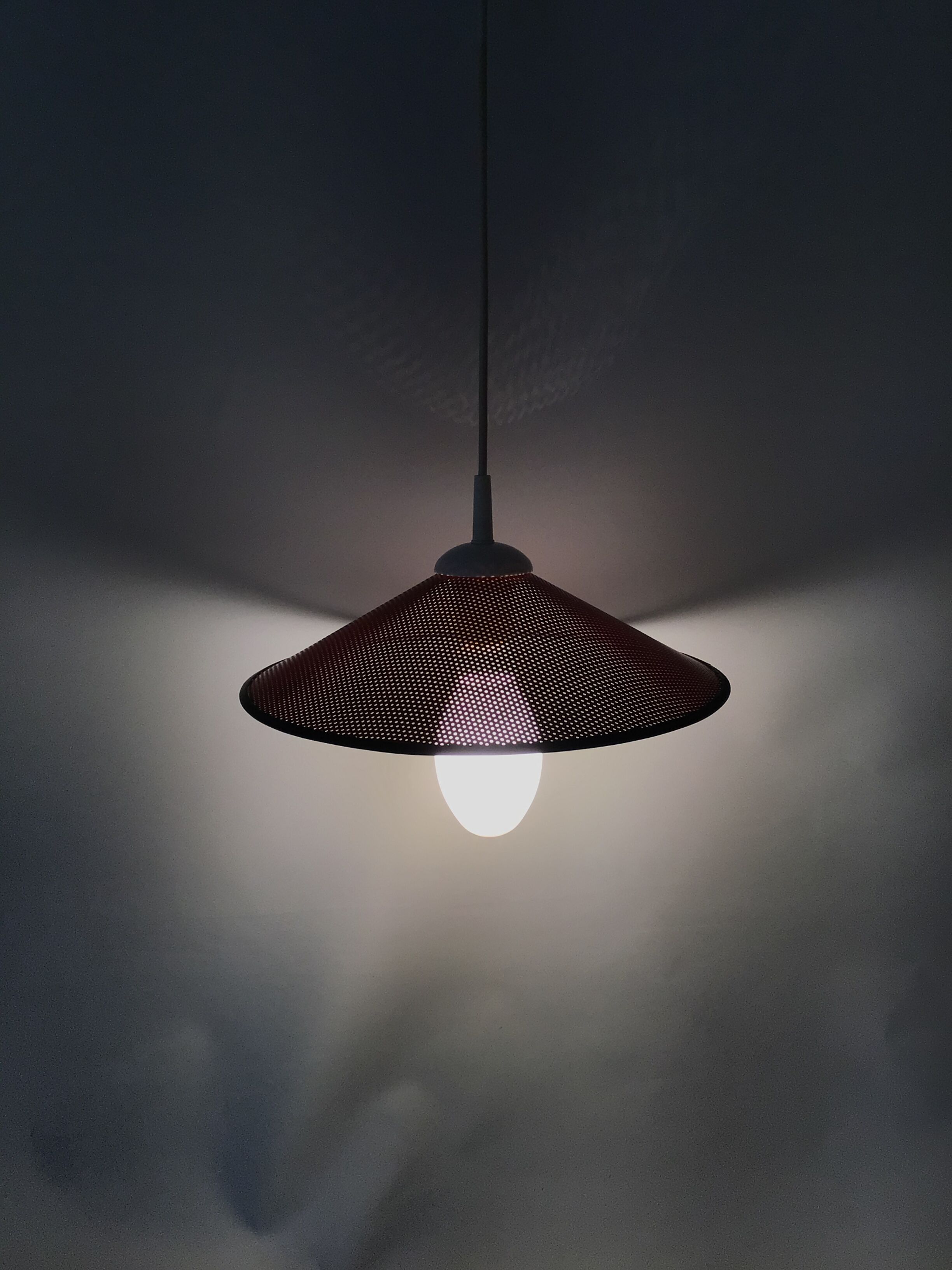 Perforated metal suspension