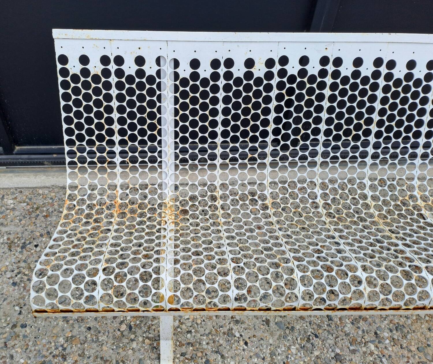 Garden bench in iron and perforated sheet metal