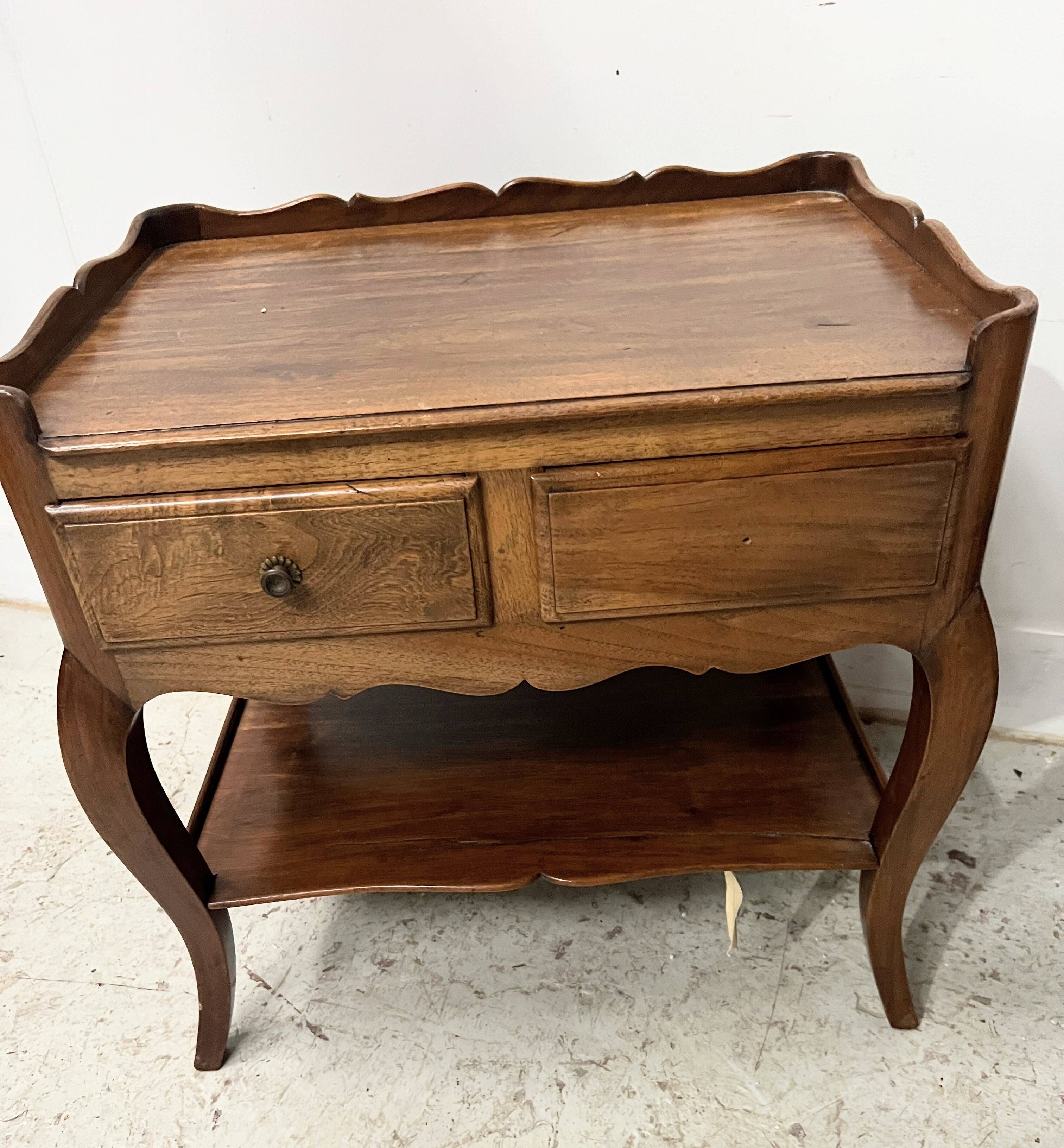 Louis XV style bedside table in solid walnut, 20th century.