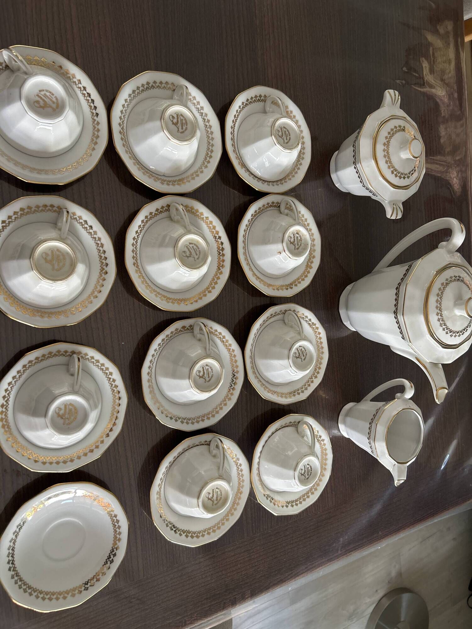 a vintage coffee or tea set in white porcelain with patterns and