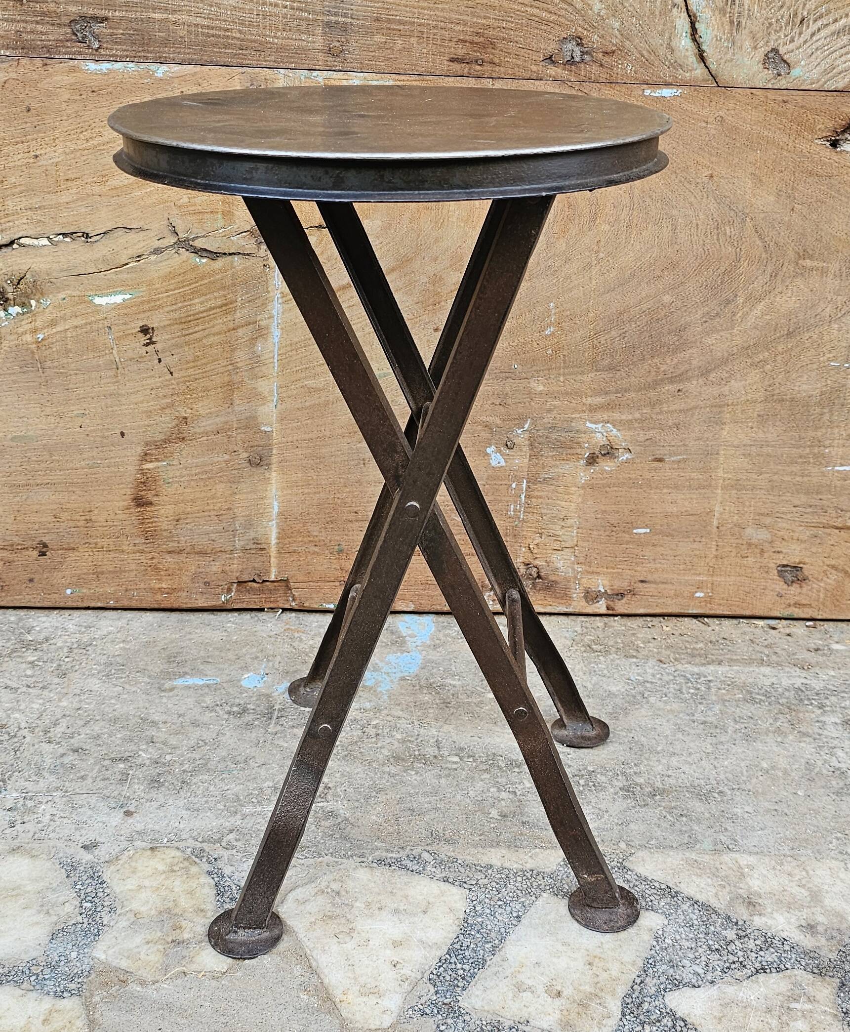 Old industrial folding steel stool