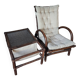 Relaxed armchair in bamboo and rattan with its small side table. Beige linen cushion.