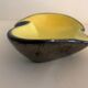 Yellow and black ceramic ashtray