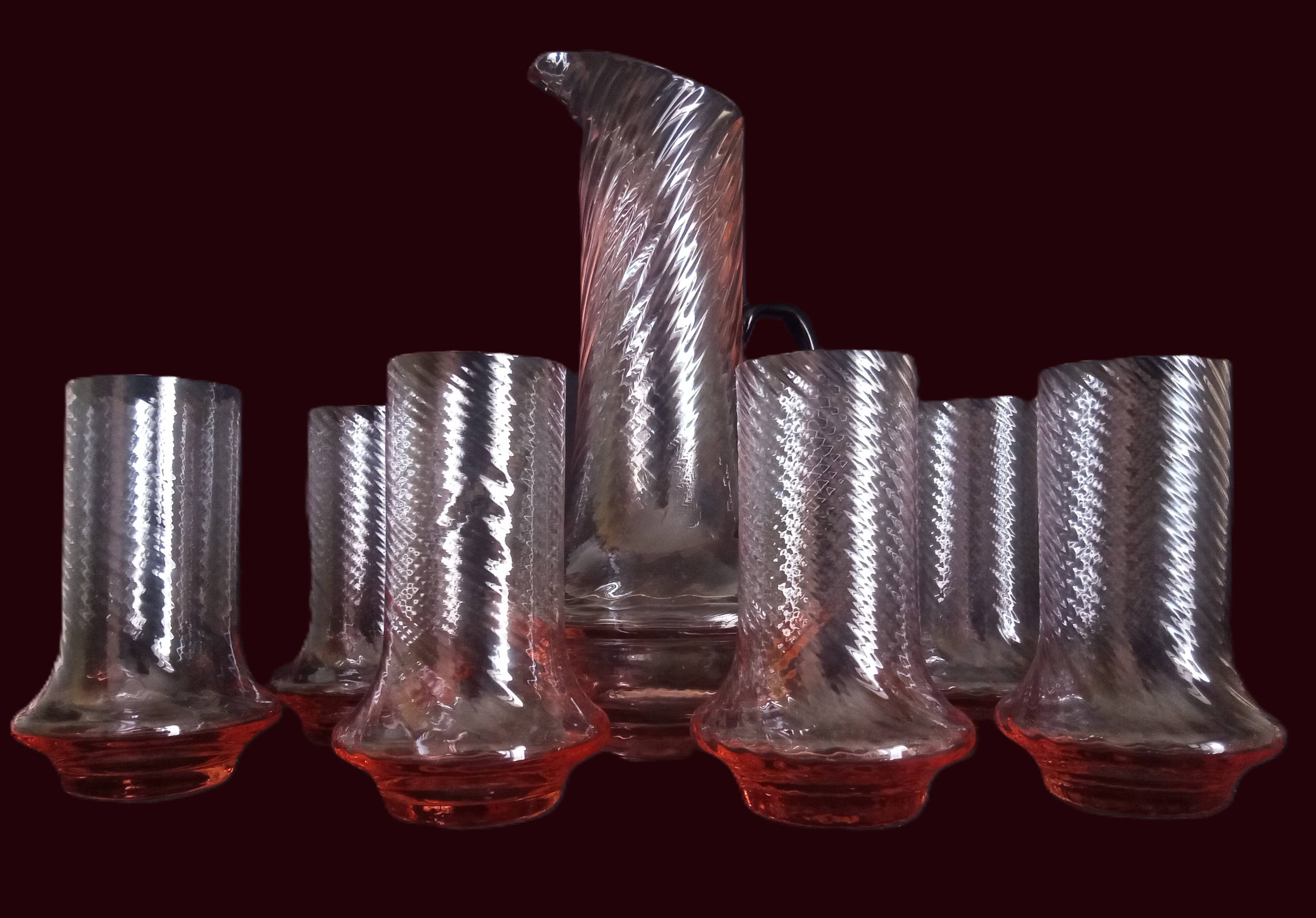 Art Deco orangeade service in pink-orange glass, twisted model.