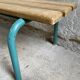 Vintage wood kindergarten bench and tubular structure in long