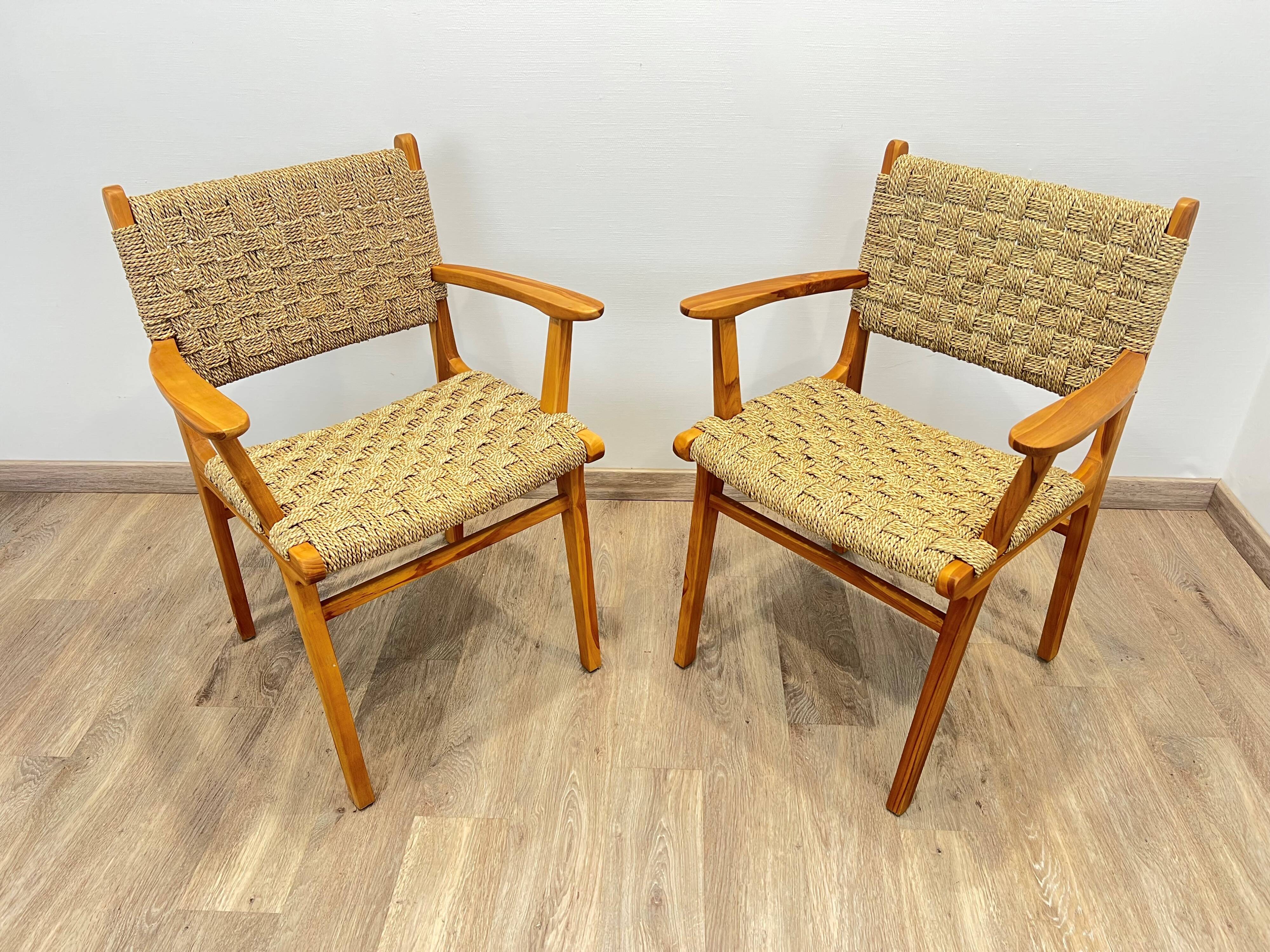 Pair of woven teak armchairs